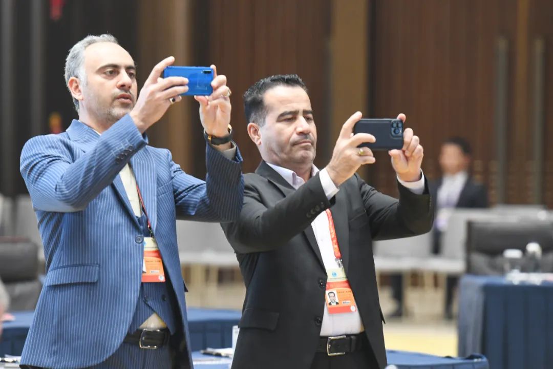 Attendees take pictures to capture the wonderful moments.